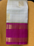 Pale green zari buttas Kanchipuram silk saree, contrast one-sided korvai rettai pettu border of rekku,mayil, manga, and diamond, and pallu of manga, and vanki