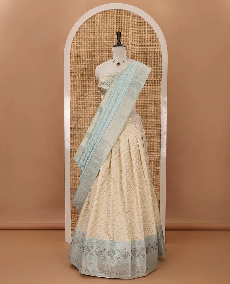 Cream semi-banaras material chudidar,leheriya zari skirt,contrast sea blue zari & swarovski stonework border,jacquard blouse & zari weave dhavani