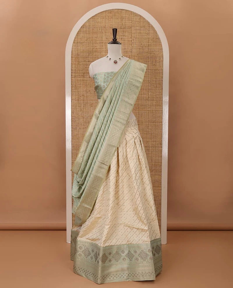 Cream semi-banaras material chudidar,leheriya zari skirt,contrast pista green zari & swarovski stonework border,jacquard blouse & zari weave dhavani