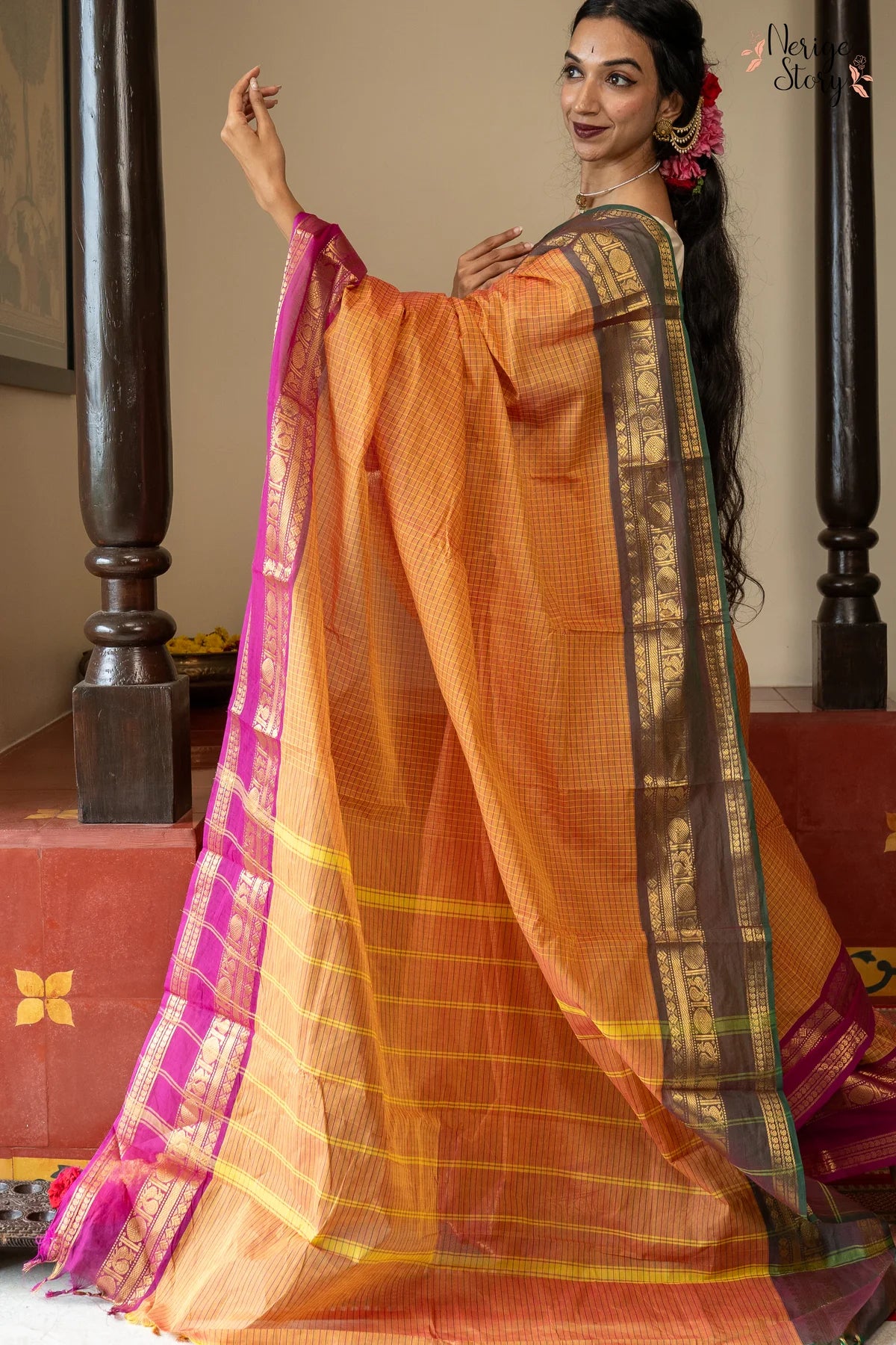 A lovely chequered orange Chettinad cotton saree with a dual-shaded green and pink ganga-jamuna border and a vintage gold zari border