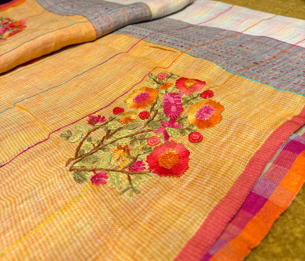 Checked linen cotton saree with contrast pallu of colourful floral motifs