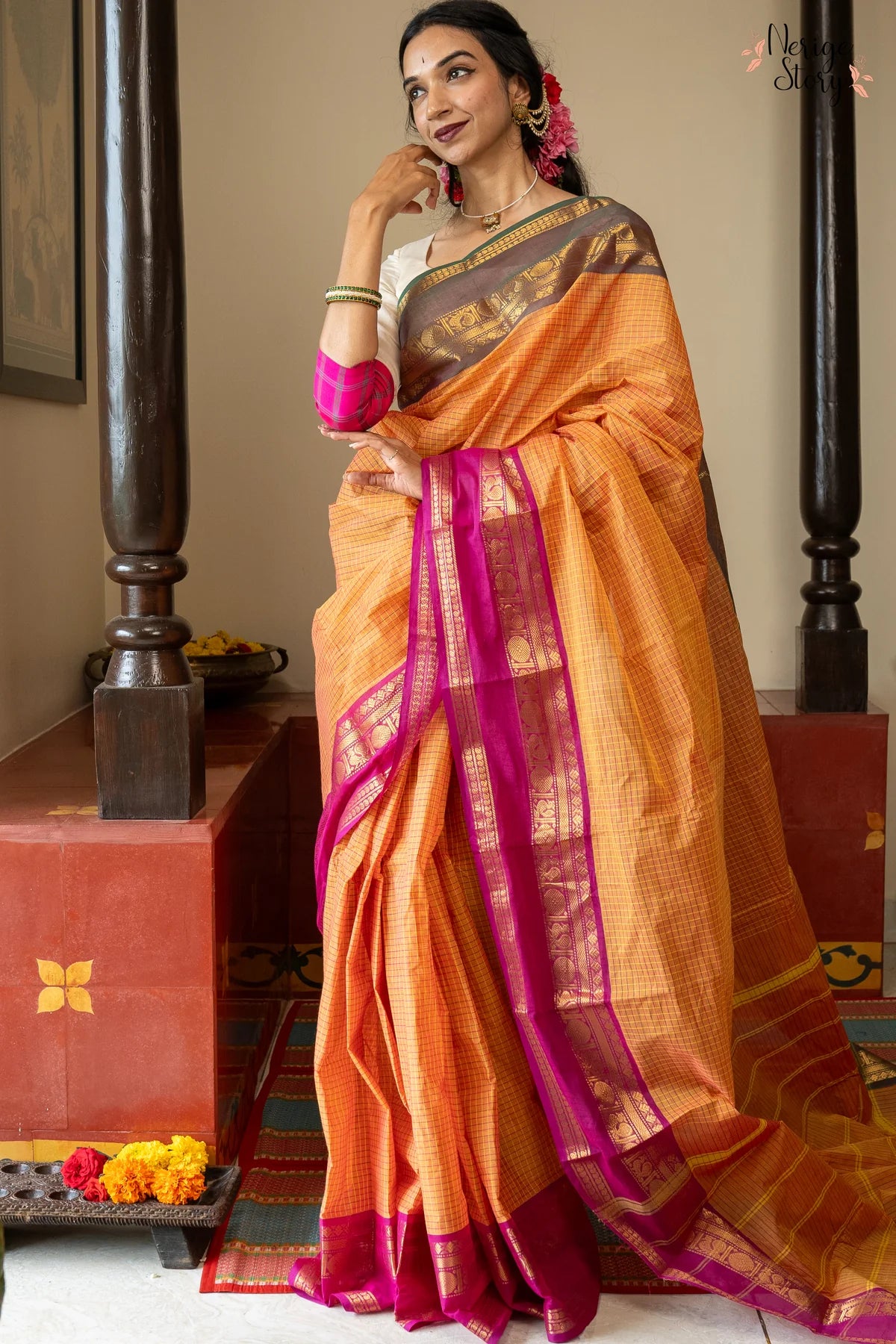 A lovely chequered orange Chettinad cotton saree with a dual-shaded green and pink ganga-jamuna border and a vintage gold zari border