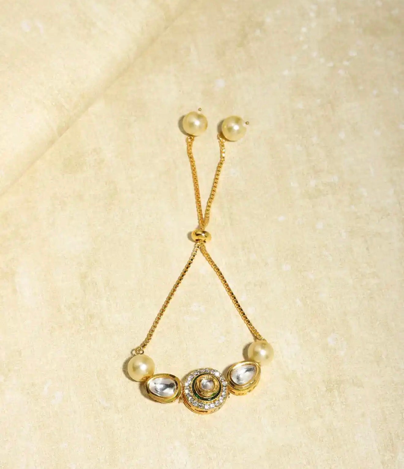 Gold plated white brass kundan charm bracelet