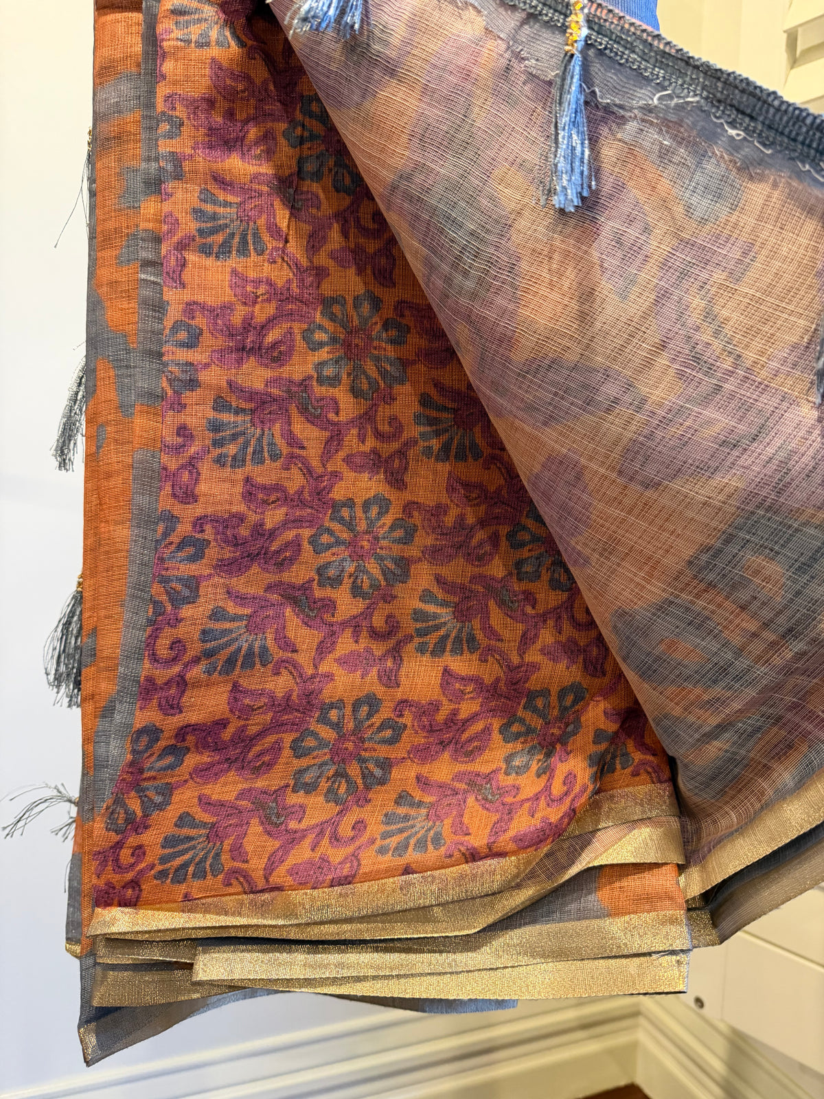 Grey Linen Cotton Saree, Detailed with Shibori Printed on Its Body, Subtle Piping Border, Pallu Features Floral Print, and Paired with a Contrast Floral Printed Blouse