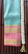 Blue mayil chakram buttas Kanchipuram silk saree, contrast rettai pettu border of thazampoo rekku, and kodi visiry, and paai madi pallu