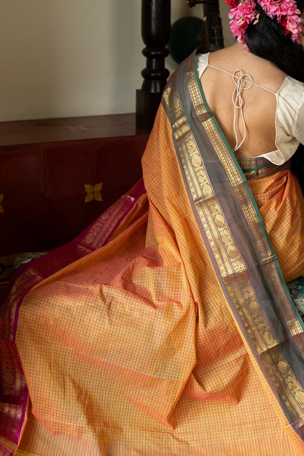 A lovely chequered orange Chettinad cotton saree with a dual-shaded green and pink ganga-jamuna border and a vintage gold zari border