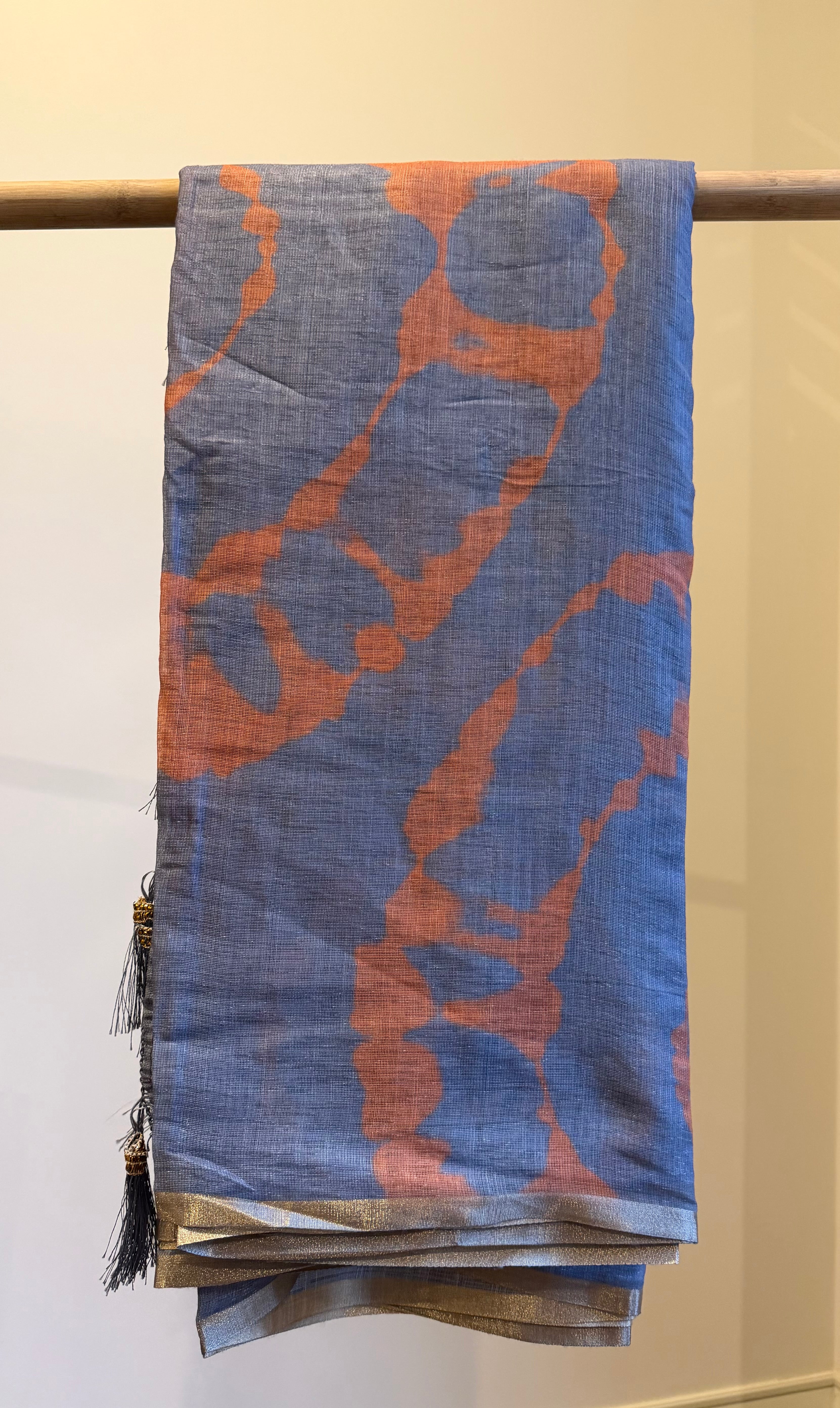 Grey Linen Cotton Saree, Detailed with Shibori Printed on Its Body, Subtle Piping Border, Pallu Features Floral Print, and Paired with a Contrast Floral Printed Blouse