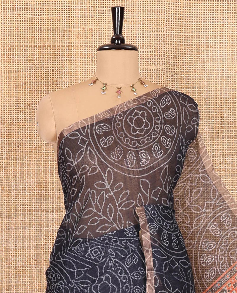 Black bandhani-style floral and chakra printed saree, zari piping border, contrast ajrakh printed pallu, and contrast ajrakh printed blouse