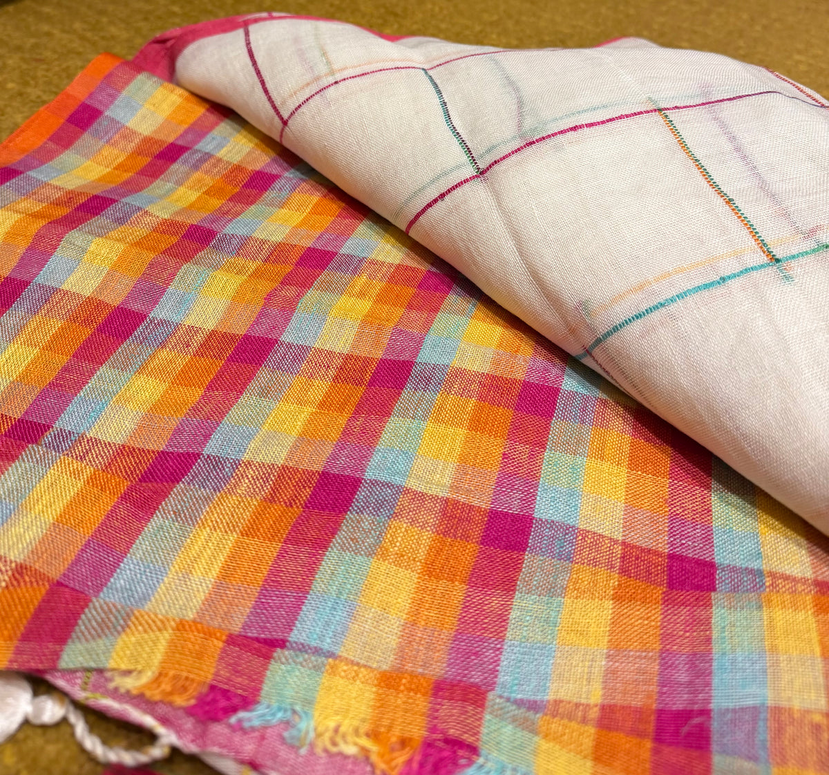 Checked linen cotton saree with contrast pallu of colourful floral motifs